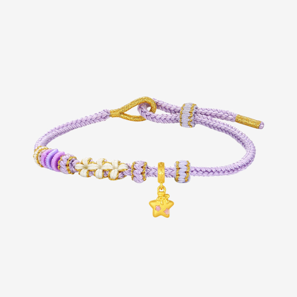 ChowTaiSeng x Baudelaire Sheep Star charm on braided bracelet, white background — 24K gold star-shaped charm with pink enamel center on dangle bail