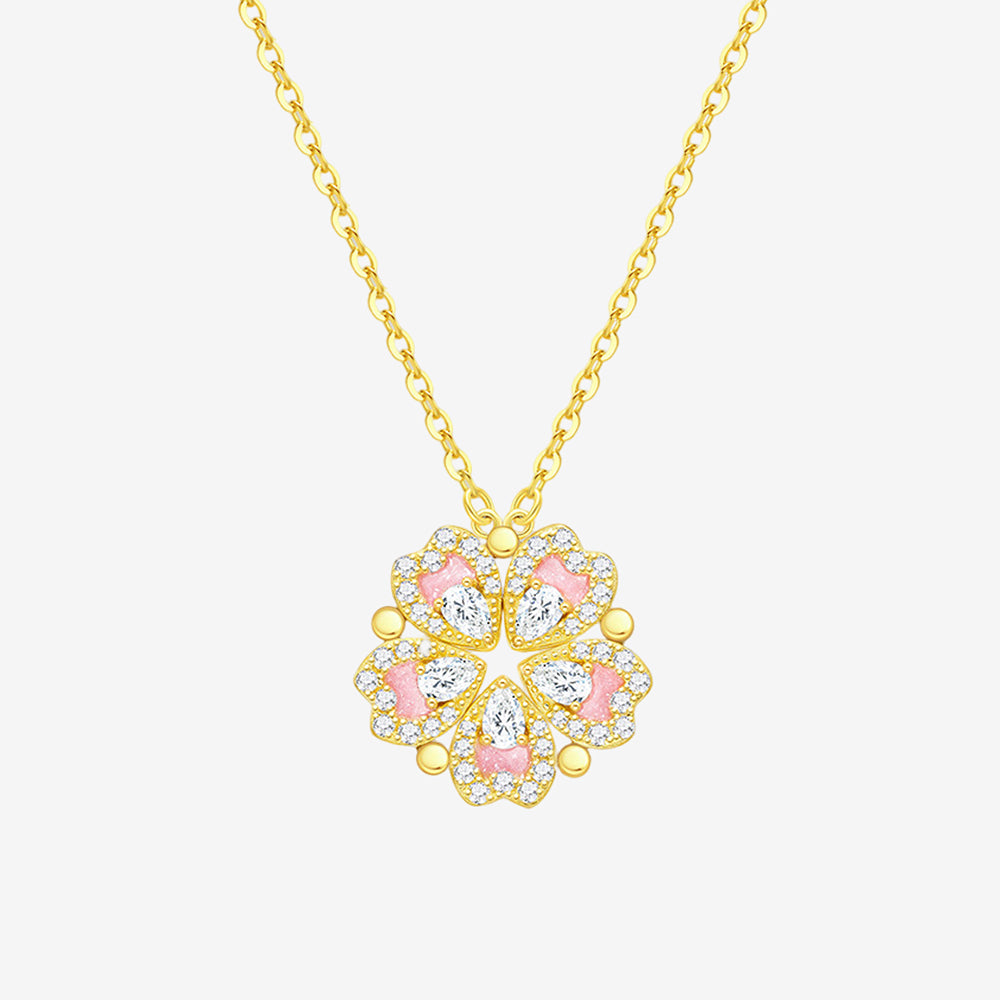 ChowTaiSeng rose gold plated silver transformable peach blossom heart necklace on white background — five pink enamel heart pendants assembled into full peach blossom flower with pear-cut white CZ centers and round CZ pavé border, rose gold ball connectors, on rose gold cable chain