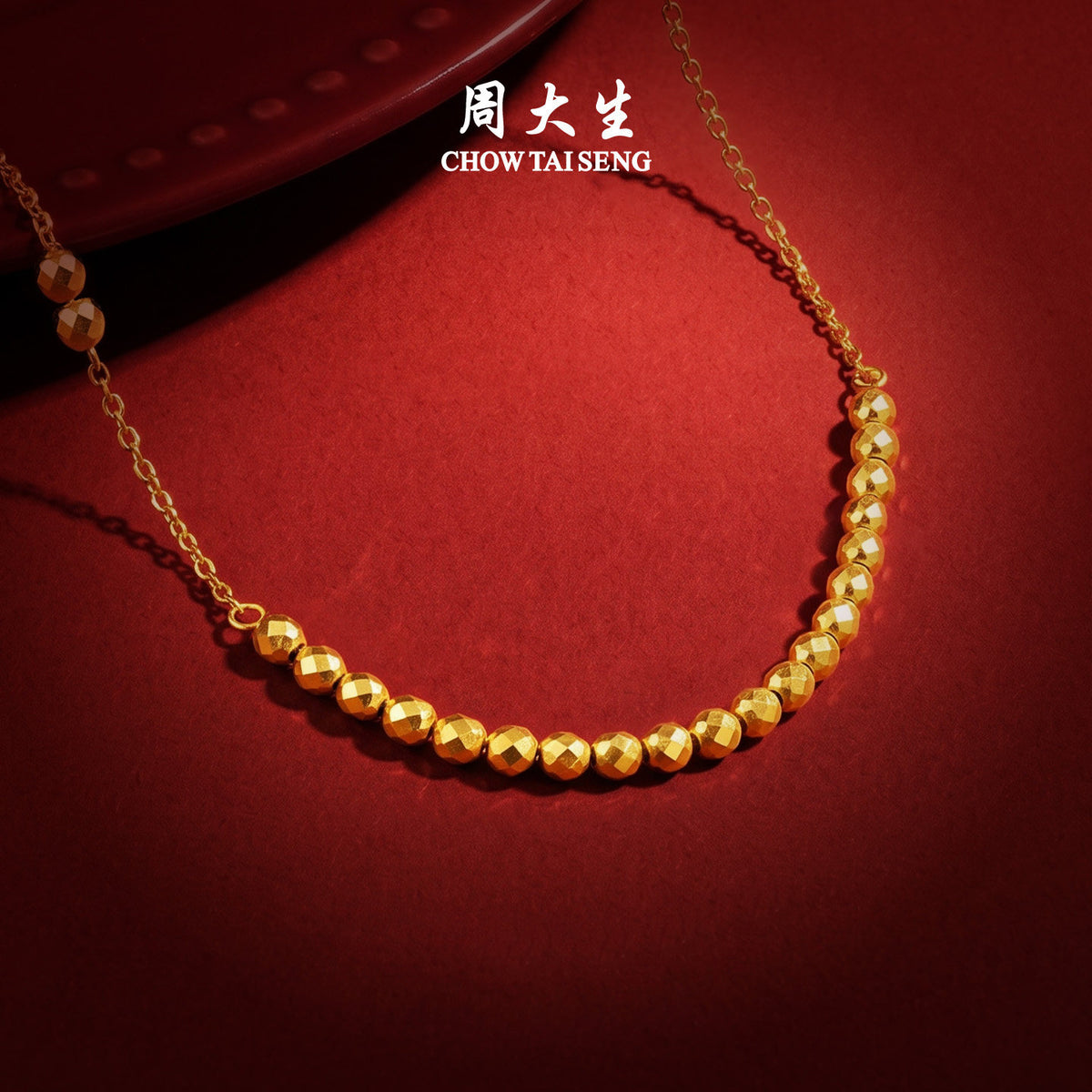 ChowTaiSeng 24K gold disco ball necklace — Pure Gold, more shining more fashion; minimalist design, simple and luxury — brand feature highlight on red background