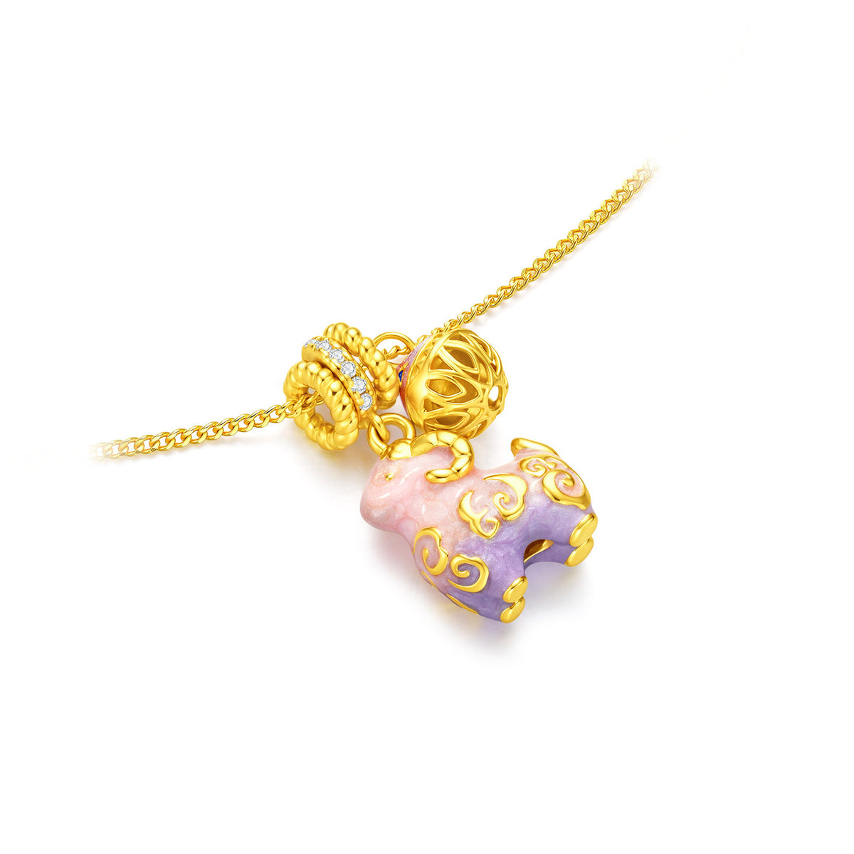 Close-up of an enamel sheep pendant with golden swirl details, cubic zirconia and an openwork bell-shaped charm