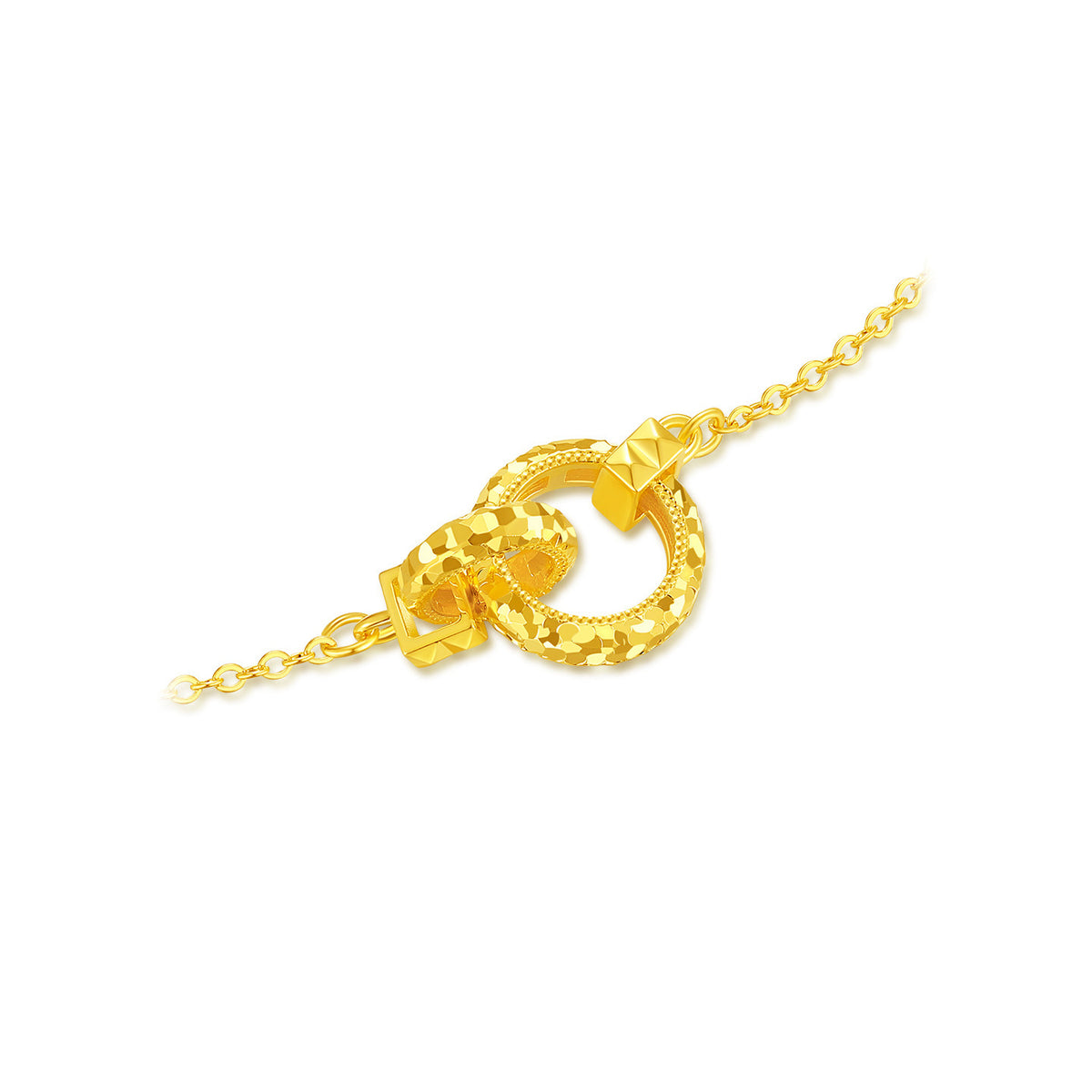 Gold-plated silver interlocking rings with faceted surfaces and geometric connectors on white