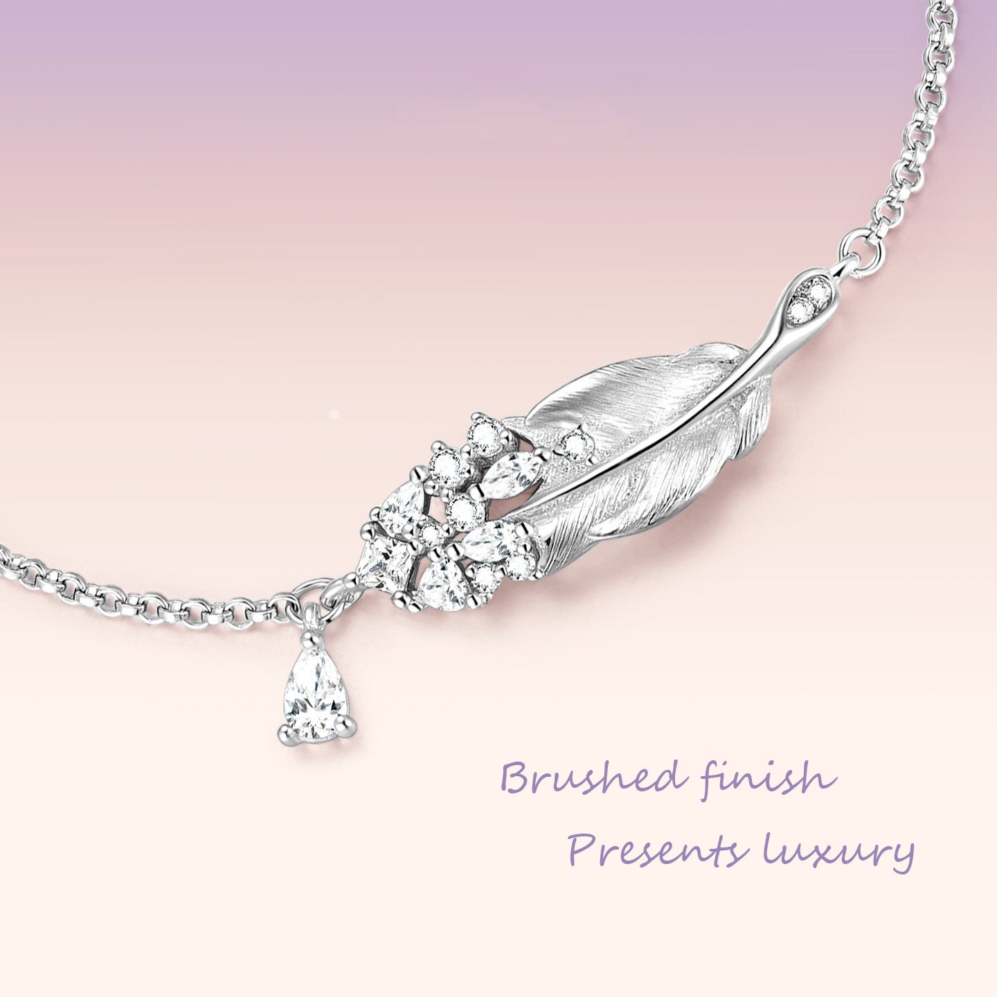 Close-up macro detail of sterling silver swan feather bracelet centerpiece showing brushed finish and sparkling cubic zirconia pave cluster with teardrop drop