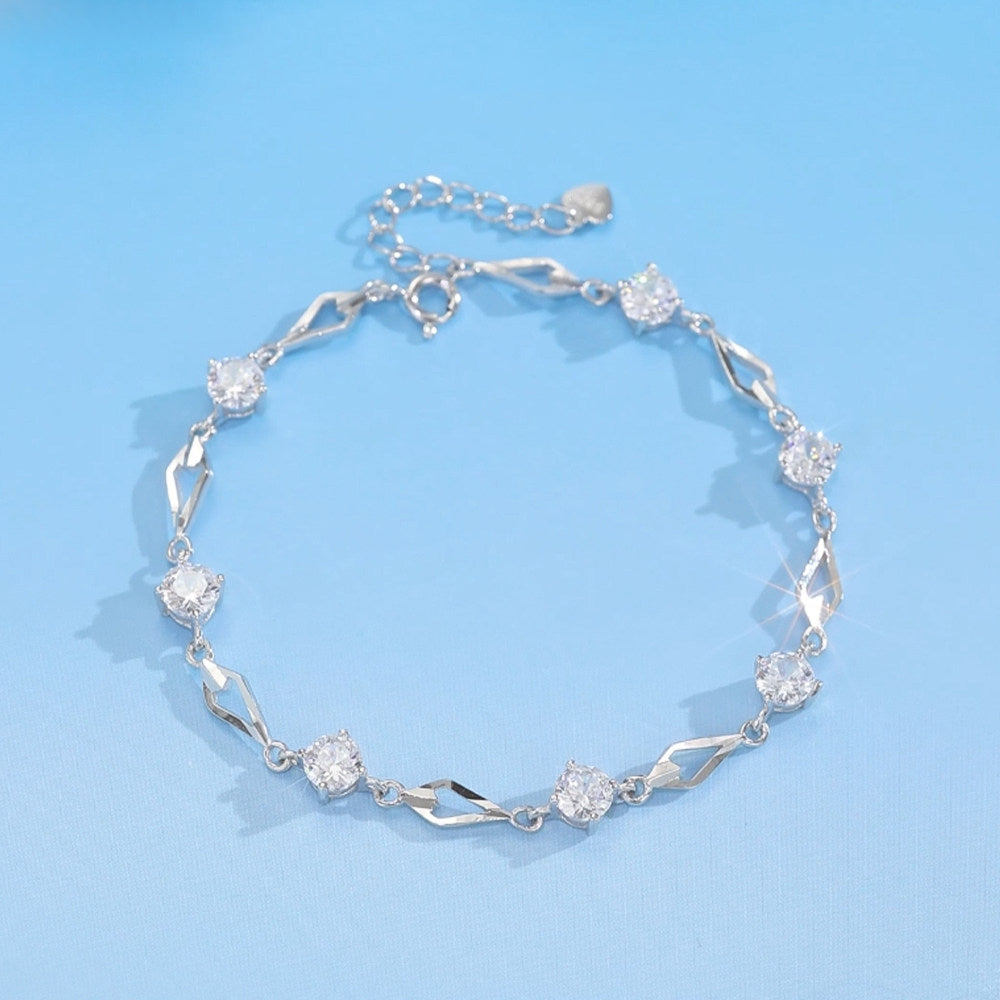 Close-up of rhombus heart charm with sparkling cubic zirconia on 925 sterling silver bracelet – ChowTaiSeng