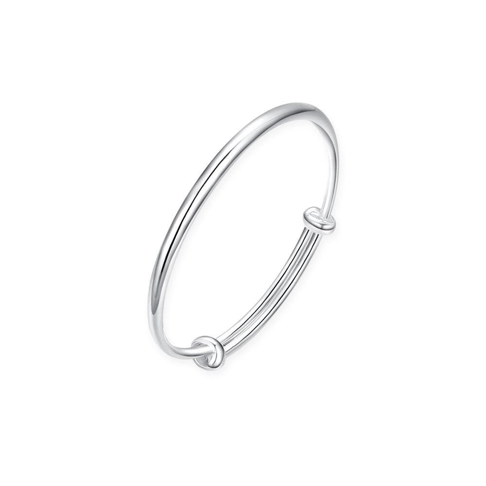 ChowTaiSeng 990 pure silver polished baby bangle single piece on white background — slim adjustable wire bangle with two sliding knot closures, high-polish mirror finish, suitable for newborns and infants