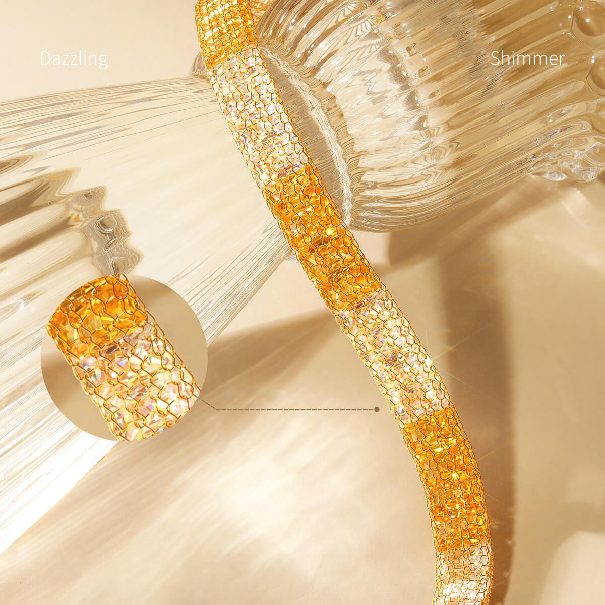 Close-up of two-tone cubic zirconia inside gold-plated silver mesh, with a magnified weave detail