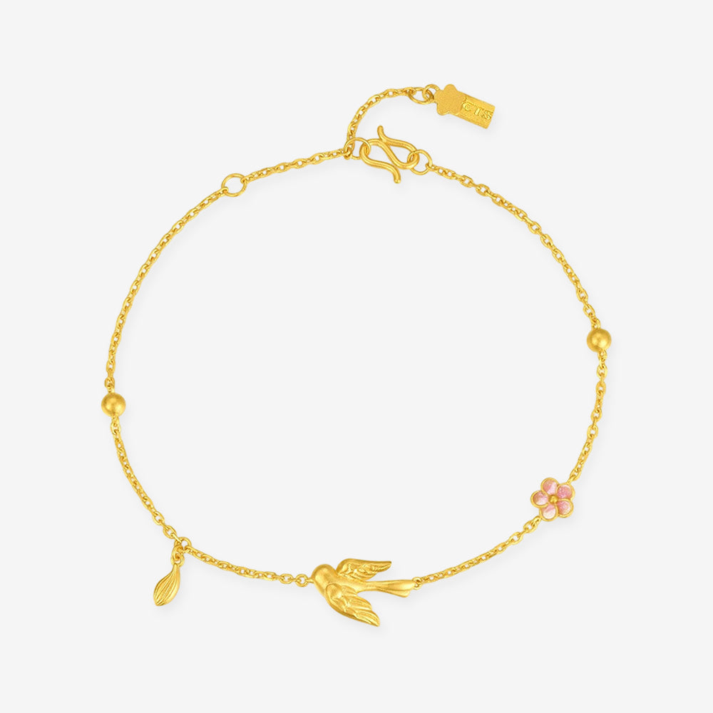 24K gold magpie and pink enamel plum blossom bracelet with a dangling leaf and polished bead accents