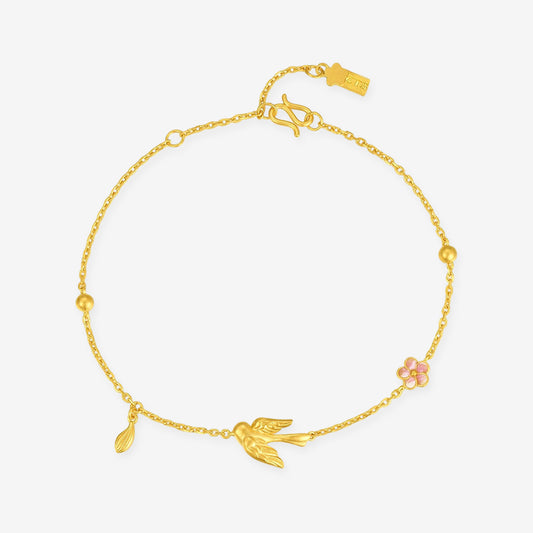 24K gold magpie and pink enamel plum blossom bracelet with a dangling leaf and polished bead accents