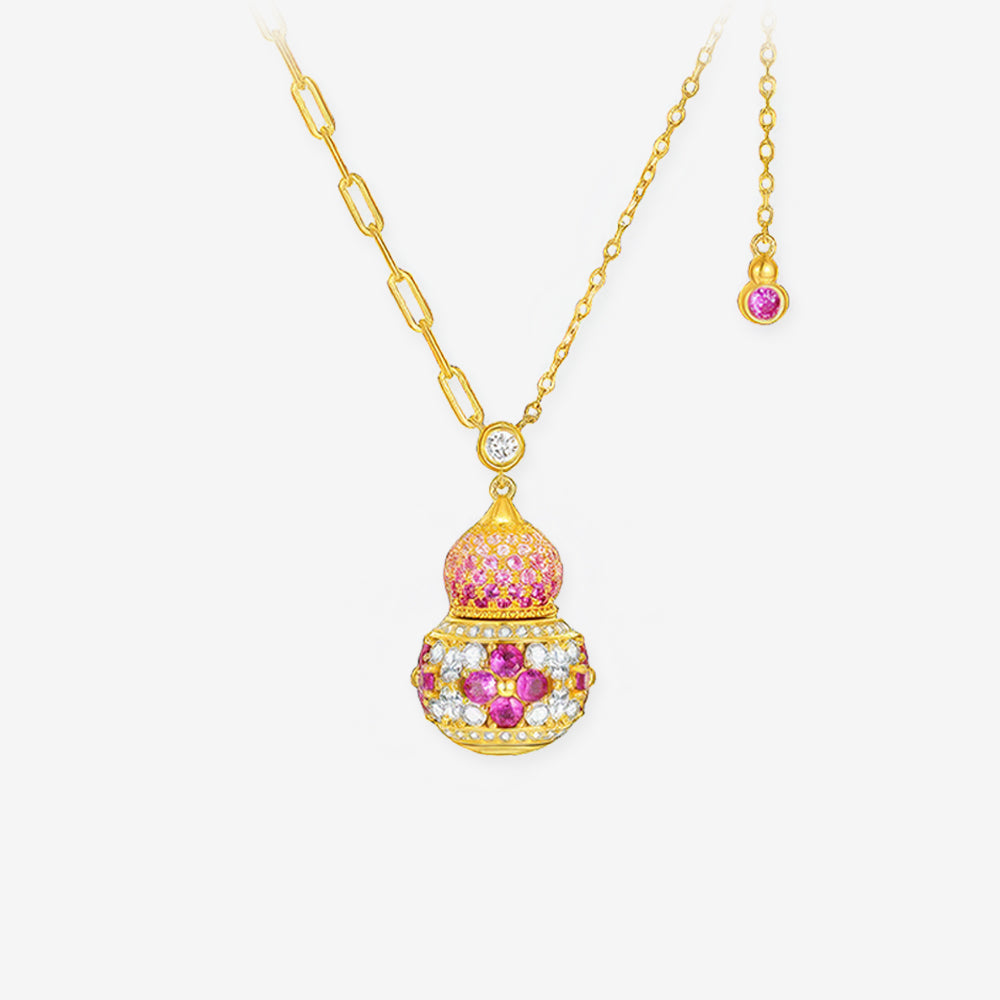 Gold-plated silver gourd necklace with pink synthetic ruby, cubic zirconia flowers and asymmetric chain on white