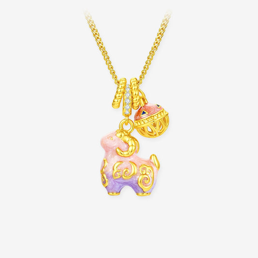 Gold-plated silver pink-purple enamel sheep necklace with cubic zirconia and a bell-shaped charm on white