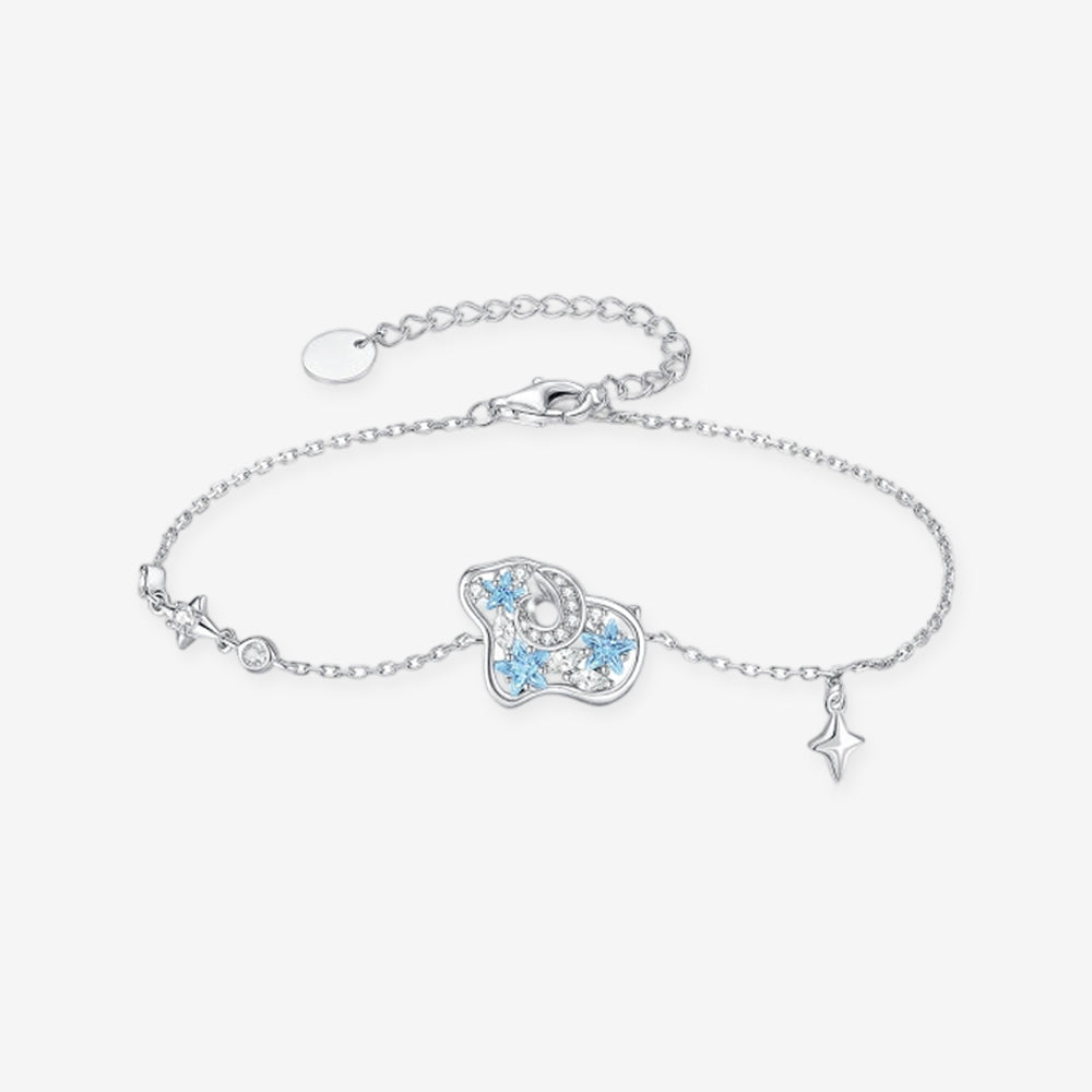Silver-tone blue cubic zirconia sheep bracelet with star charm, lobster clasp and extender on white