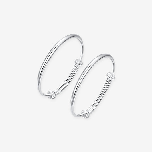 ChowTaiSeng 990 pure silver polished newborn baby bangles on white background — pair of smooth adjustable wire bangles with sliding knot closure, mirror-polished finish, SKU S0ZC0175