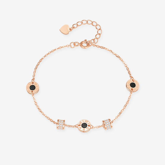 Gold-plated silver black onyx bracelet with round stations, cubic zirconia accents and an extension chain