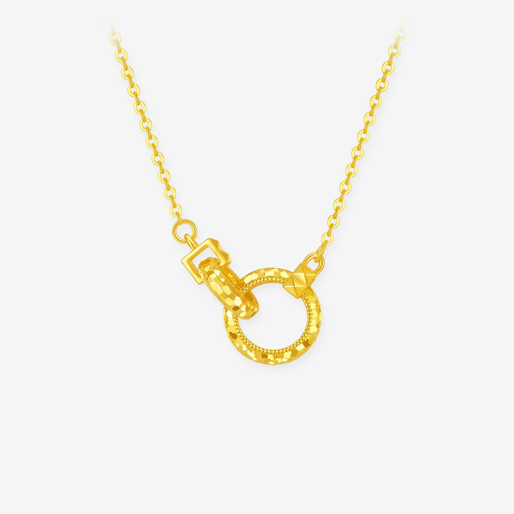 Gold-plated silver necklace with two interlocking faceted rings on a delicate chain against white